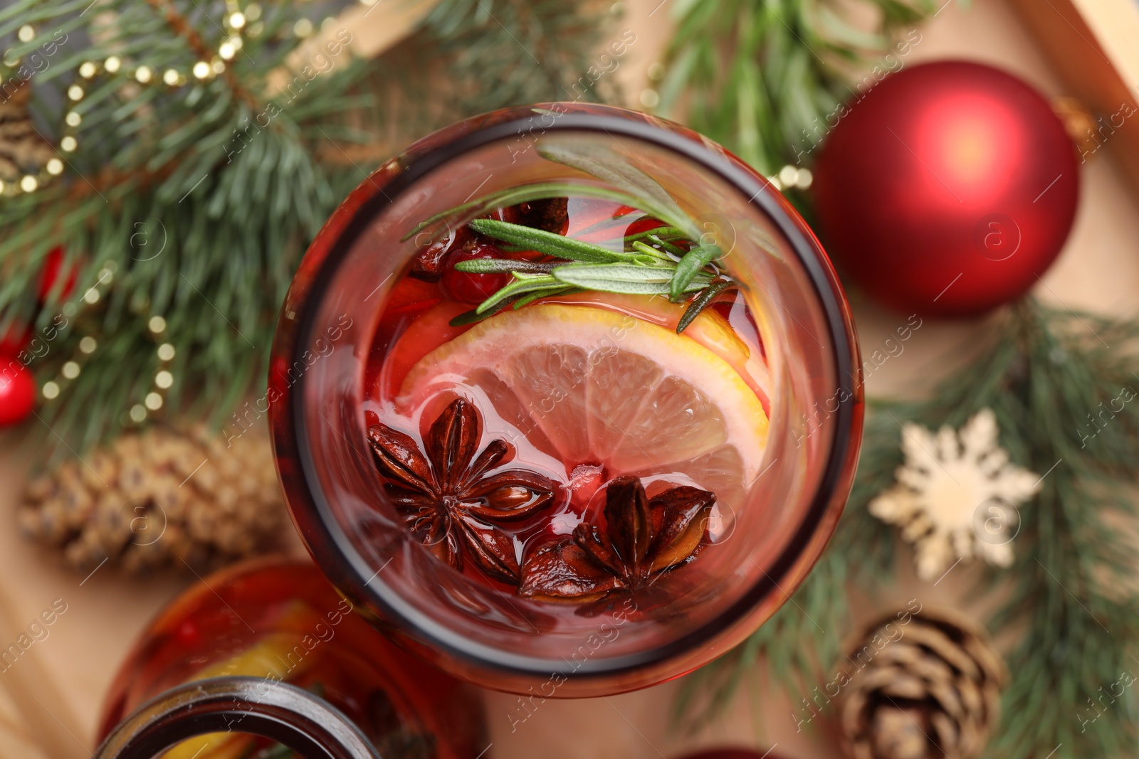 Photo of Aromatic punch drink and Christmas decor on table, flat lay