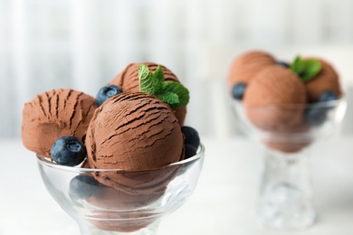 Photo of Glass bowl of chocolate ice cream, closeup with space for text