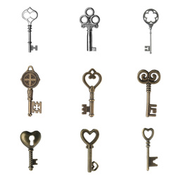 Image of Set of different ornate keys on white background