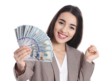 Portrait of happy young businesswoman with money on white background