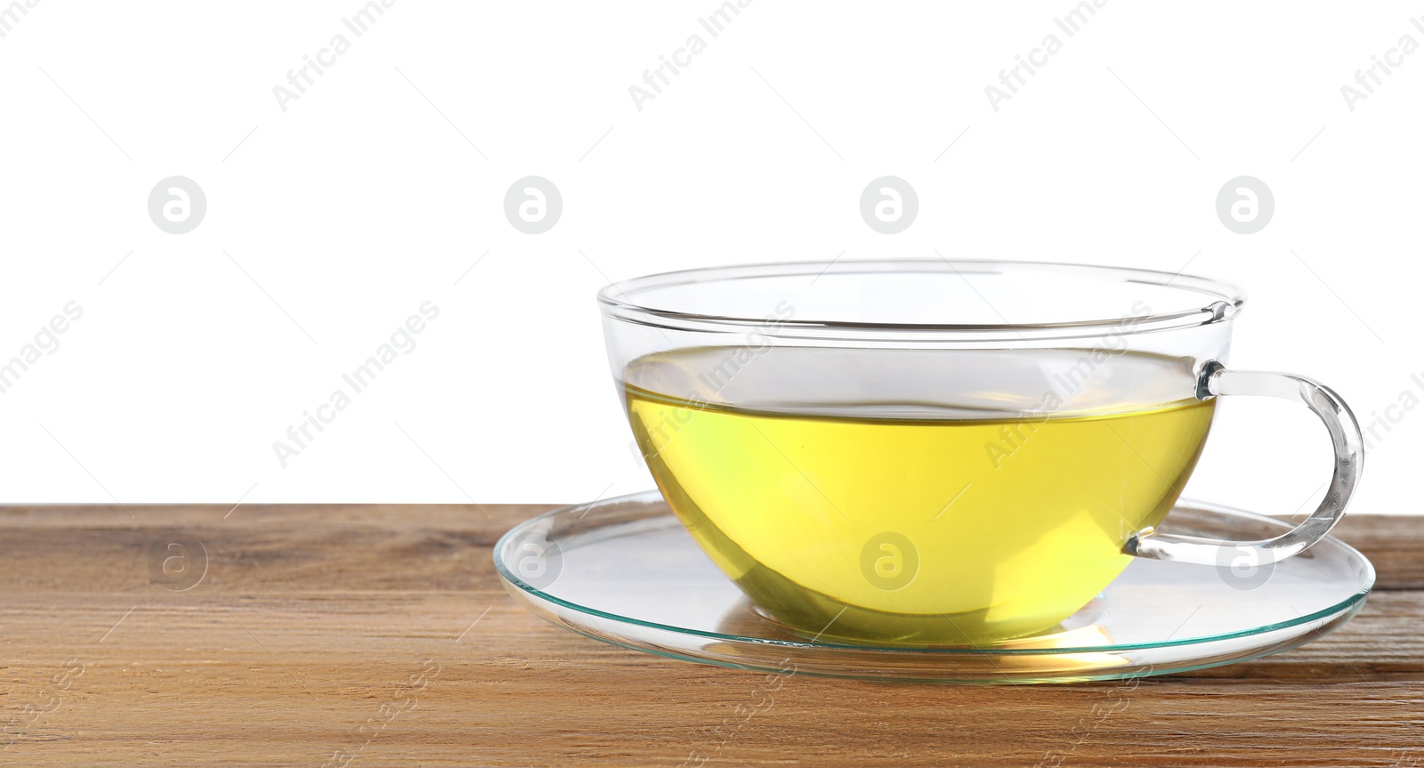 Photo of Refreshing green tea in cup on wooden table against white background