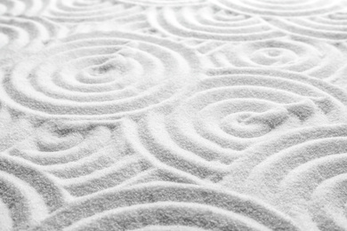 Photo of White sand with pattern as background. Zen, meditation, harmony