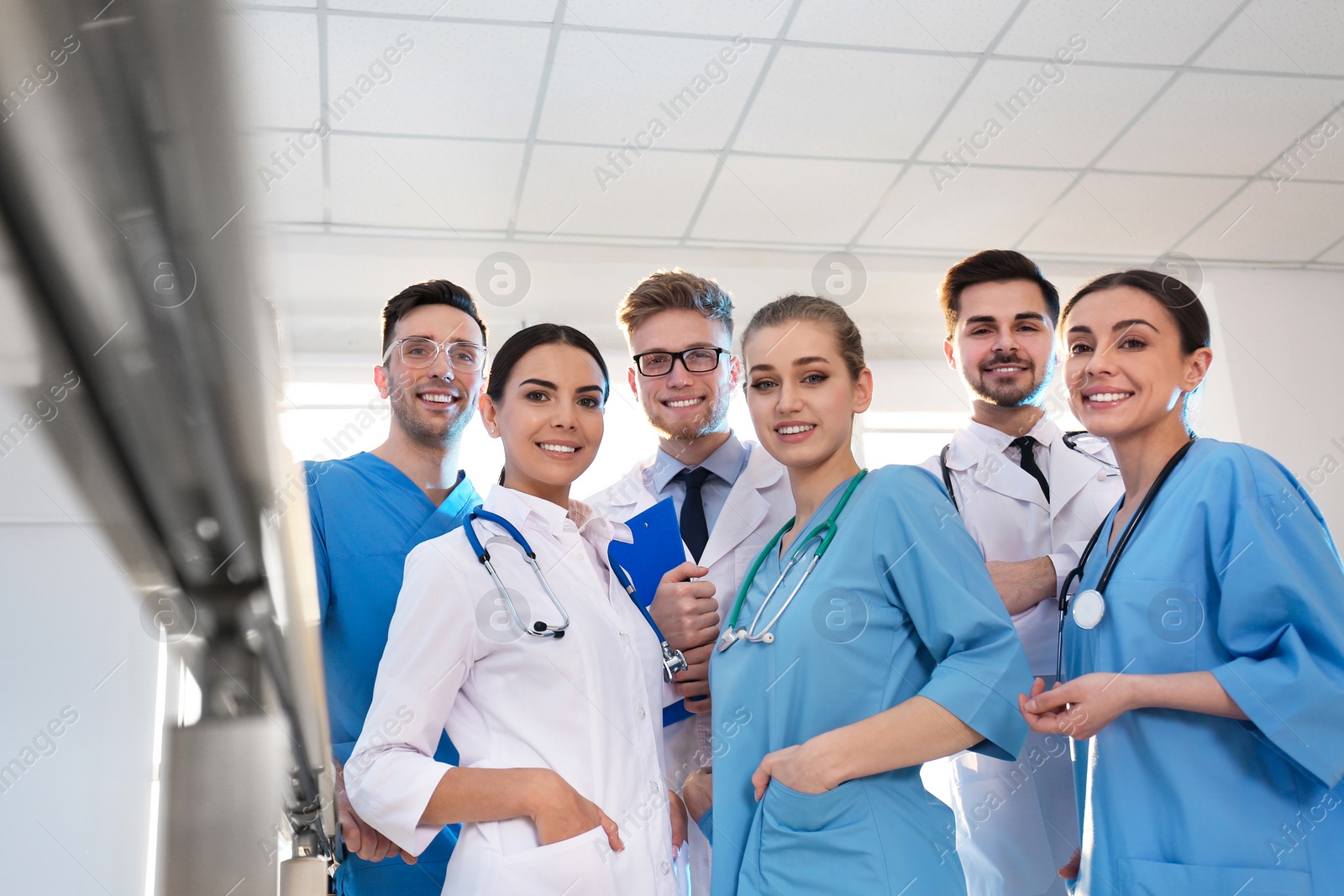 Photo of Group of medical doctors indoors. Unity concept