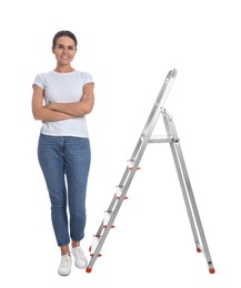 Photo of Young woman near metal ladder on white background