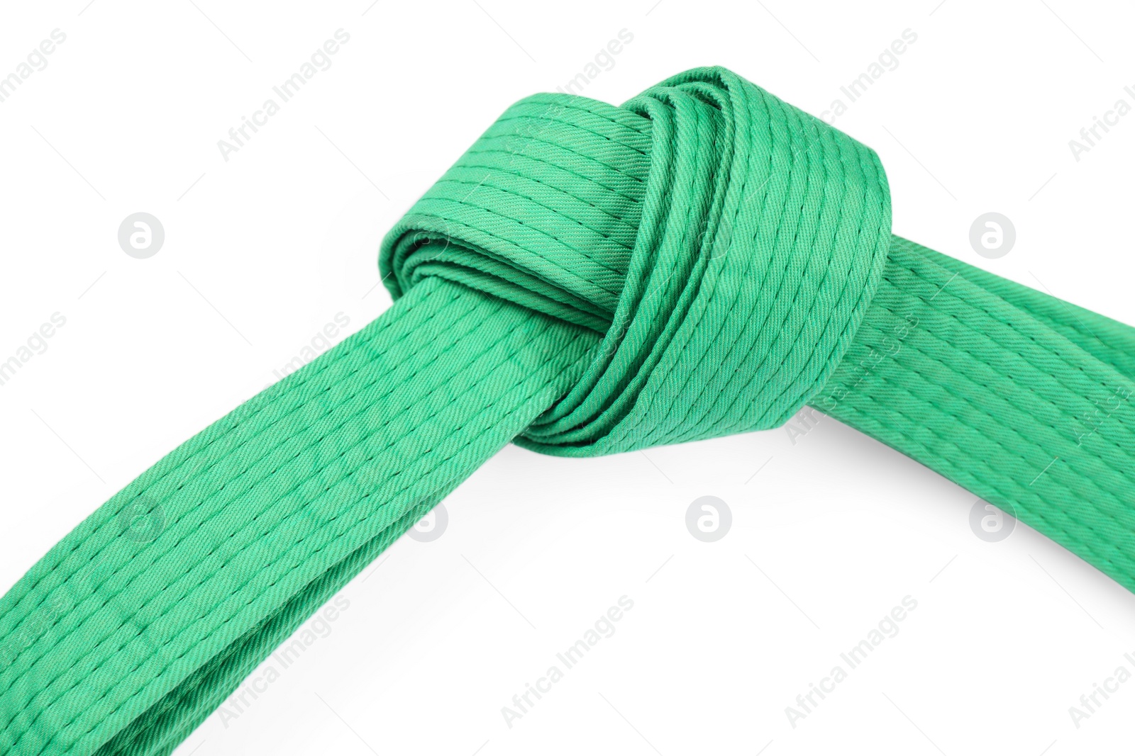 Photo of Green karate belt isolated on white. Martial arts uniform