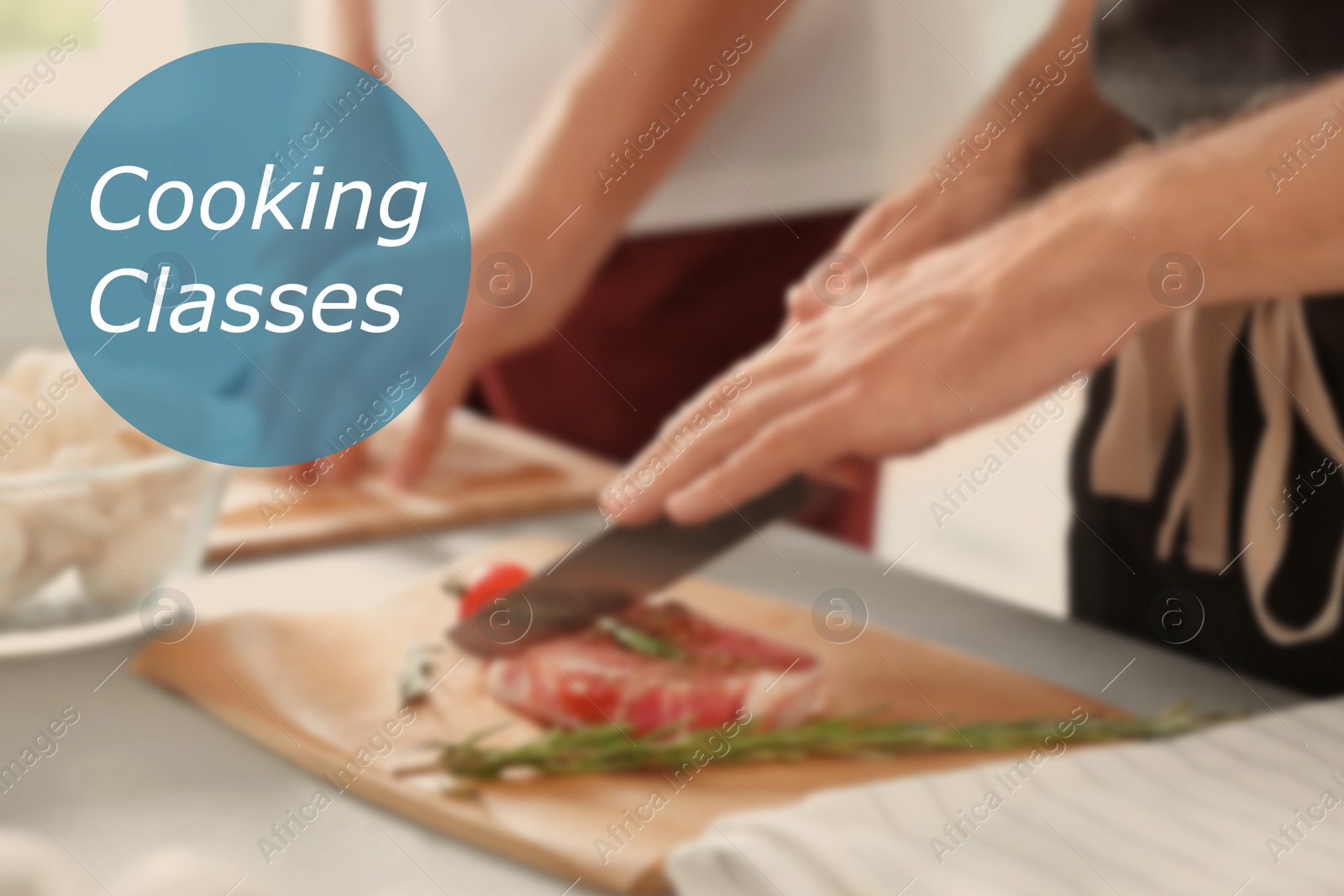 Image of Cooking classes. Blurred view of man cutting meat on wooden board at table, closeup