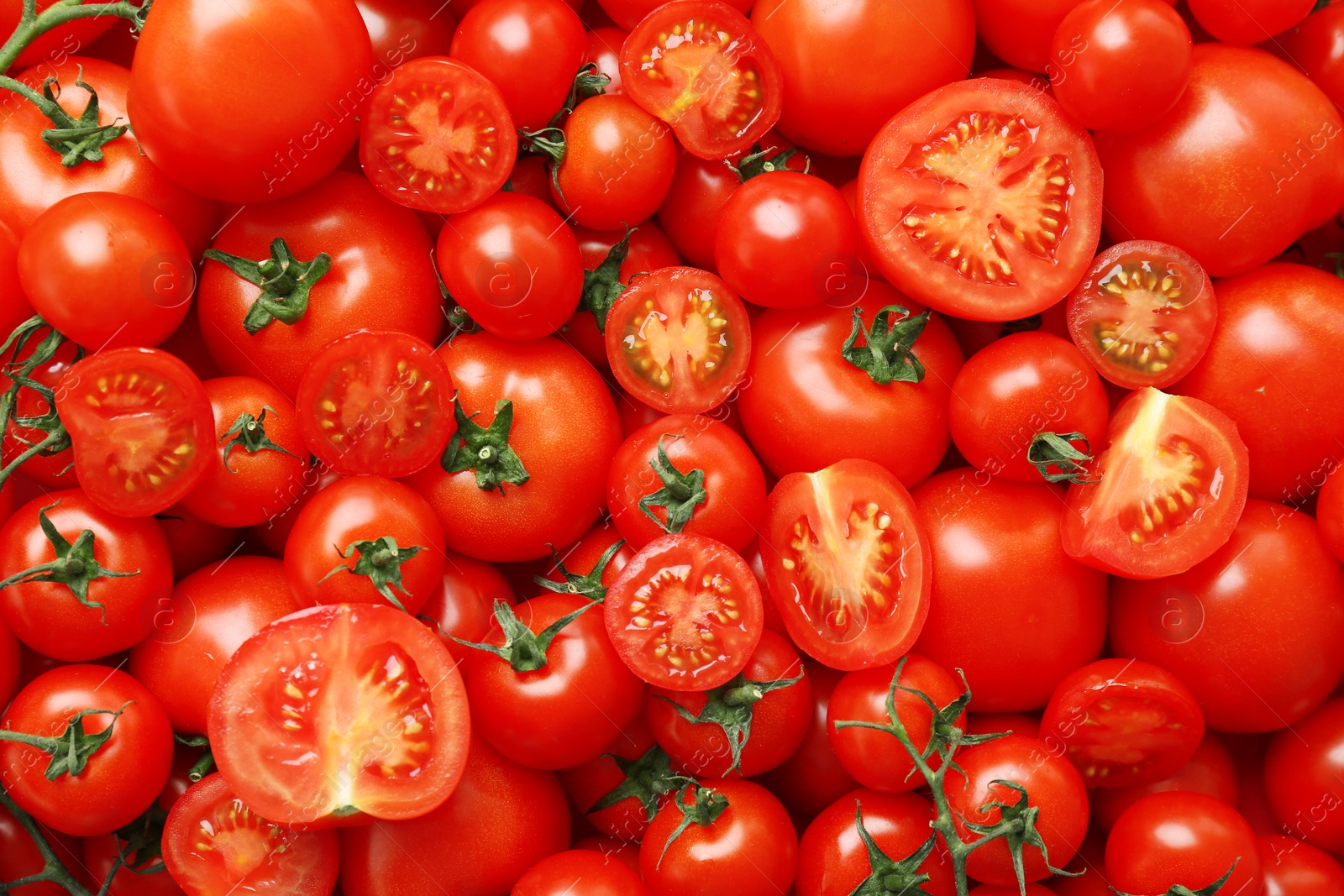 Photo of Many fresh ripe tomatoes as background, top view