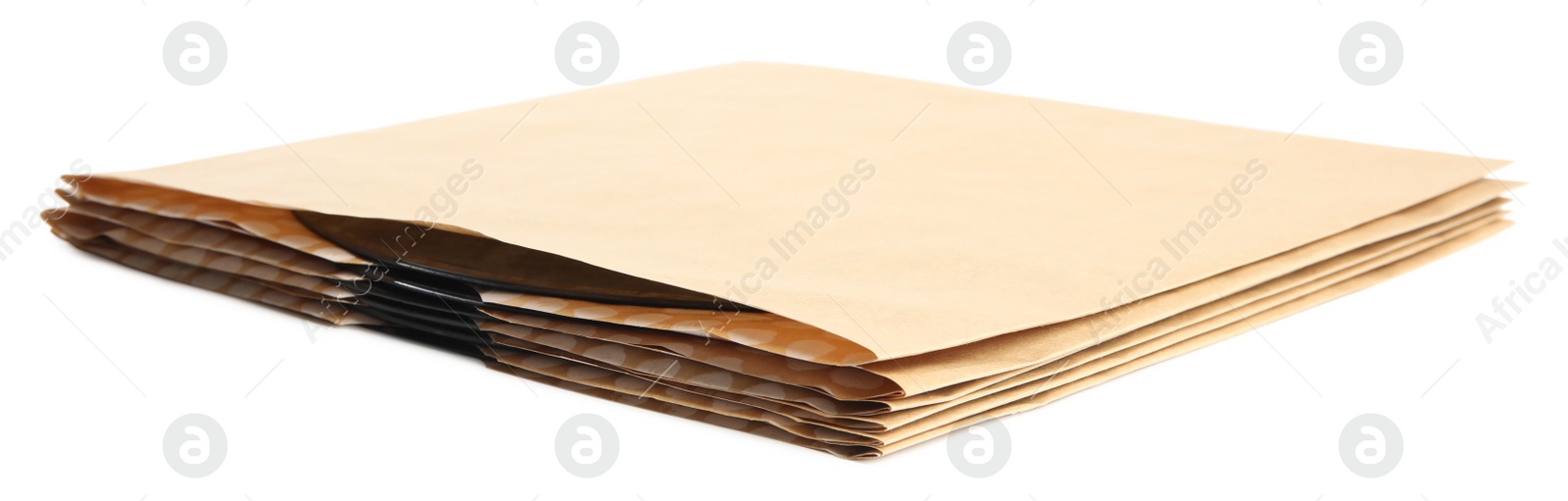 Photo of Vintage vinyl disc records in paper covers isolated on white