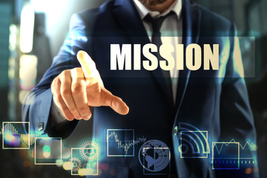 Image of Mission concept. Businessman using virtual screen, closeup