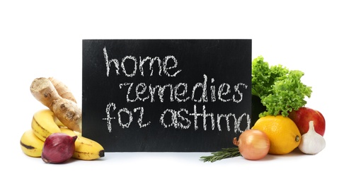 Natural products and slate board with text HOME REMEDIES FOR ASTHMA on white background