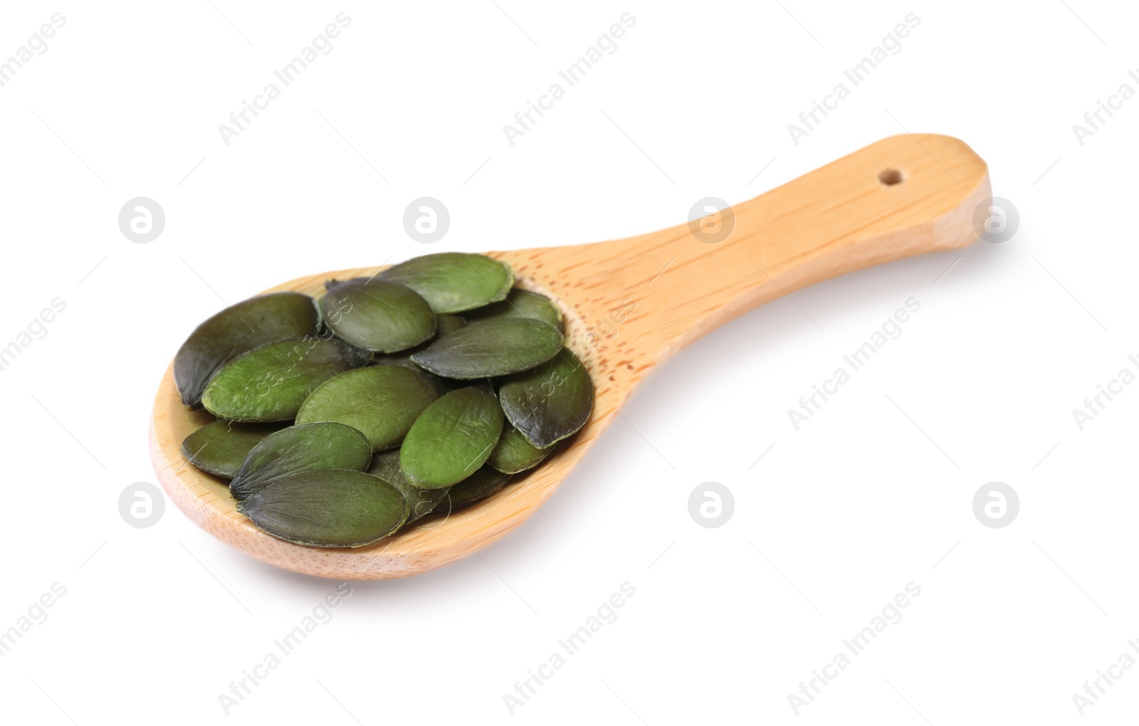 Photo of Wooden spoon with pumpkin seeds isolated on white