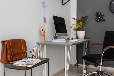 Comfortable workplace with computer on desk in home office