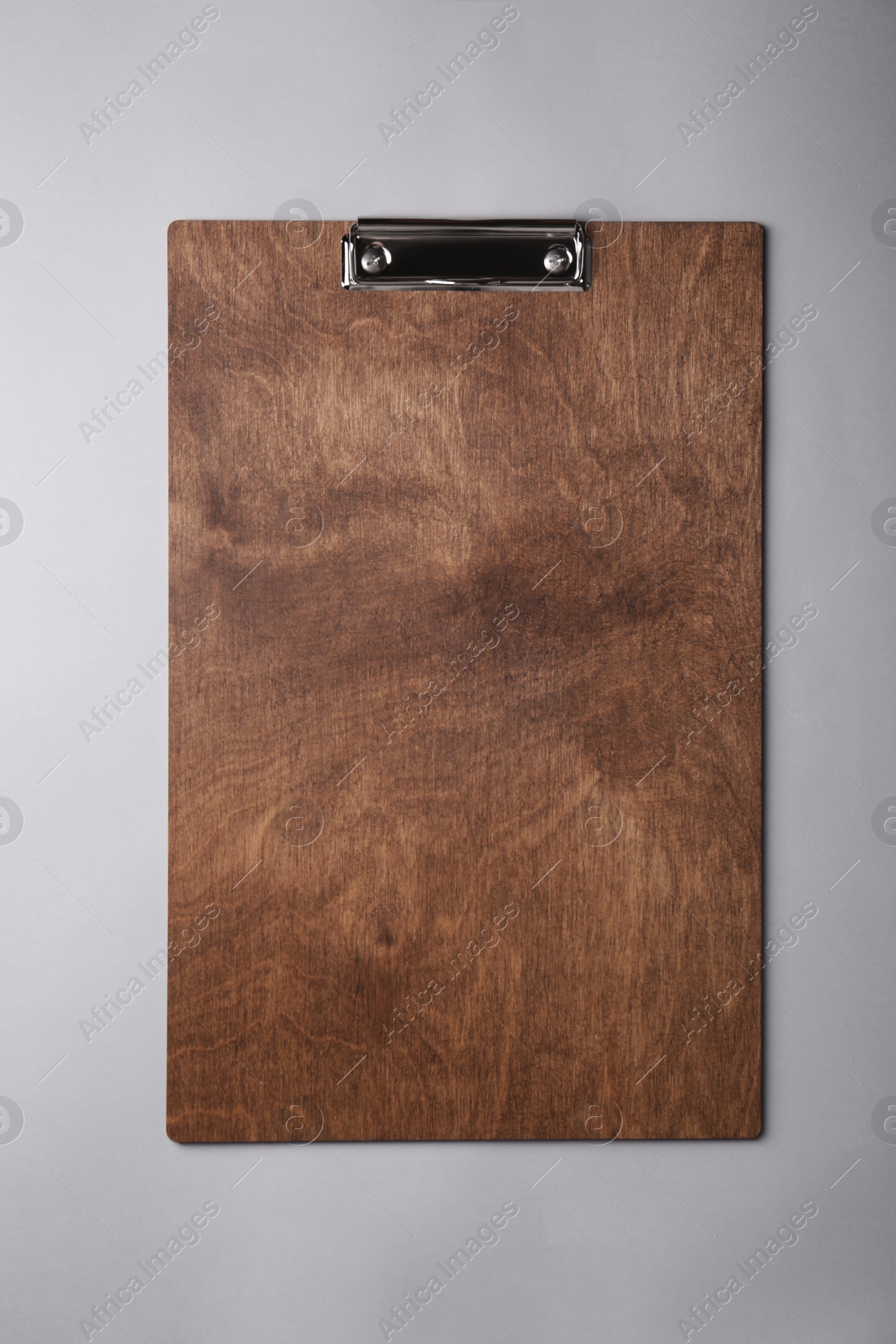 Photo of Wooden clipboard on light grey background, top view