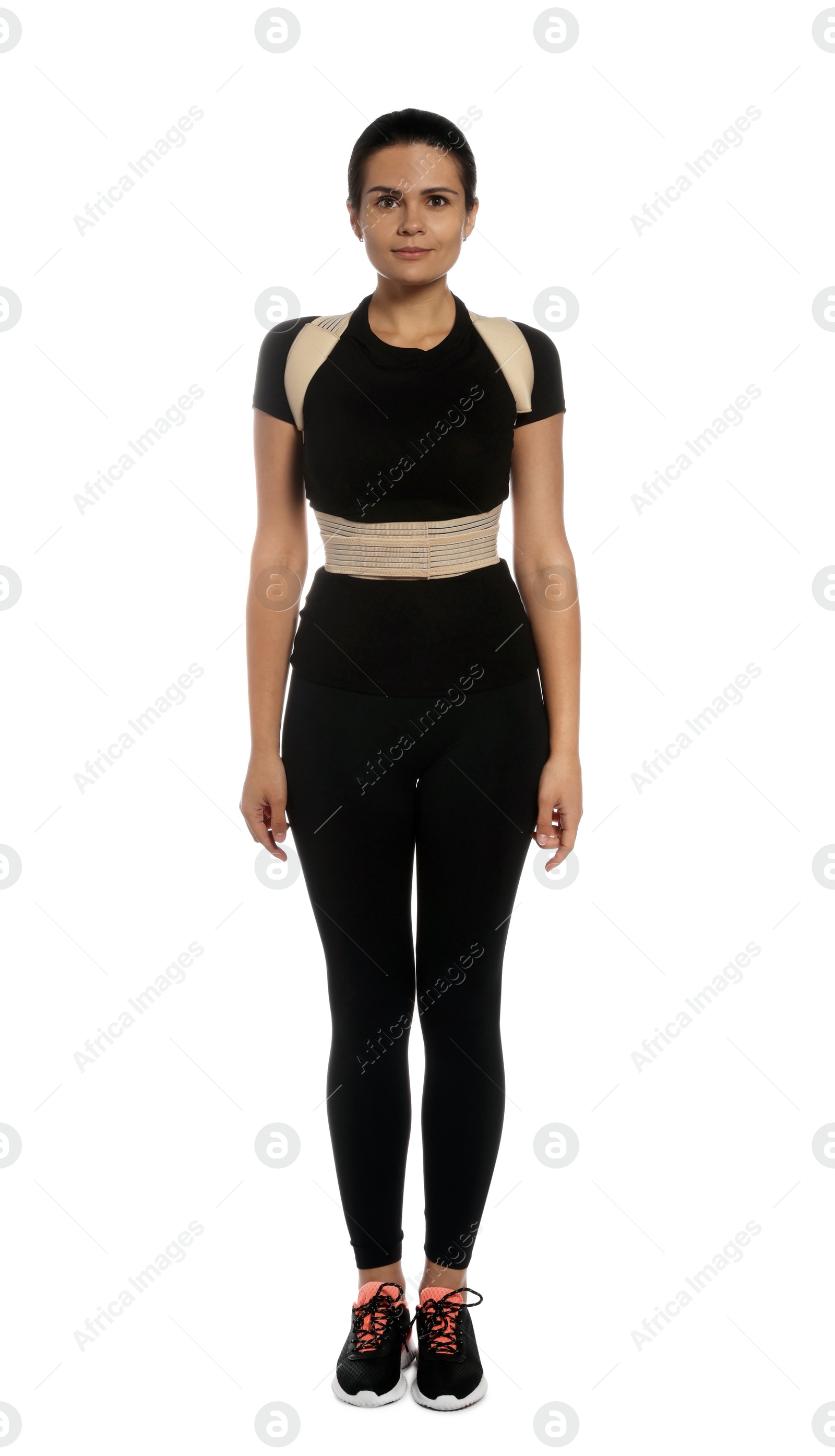 Photo of Beautiful woman with orthopedic corset on white background