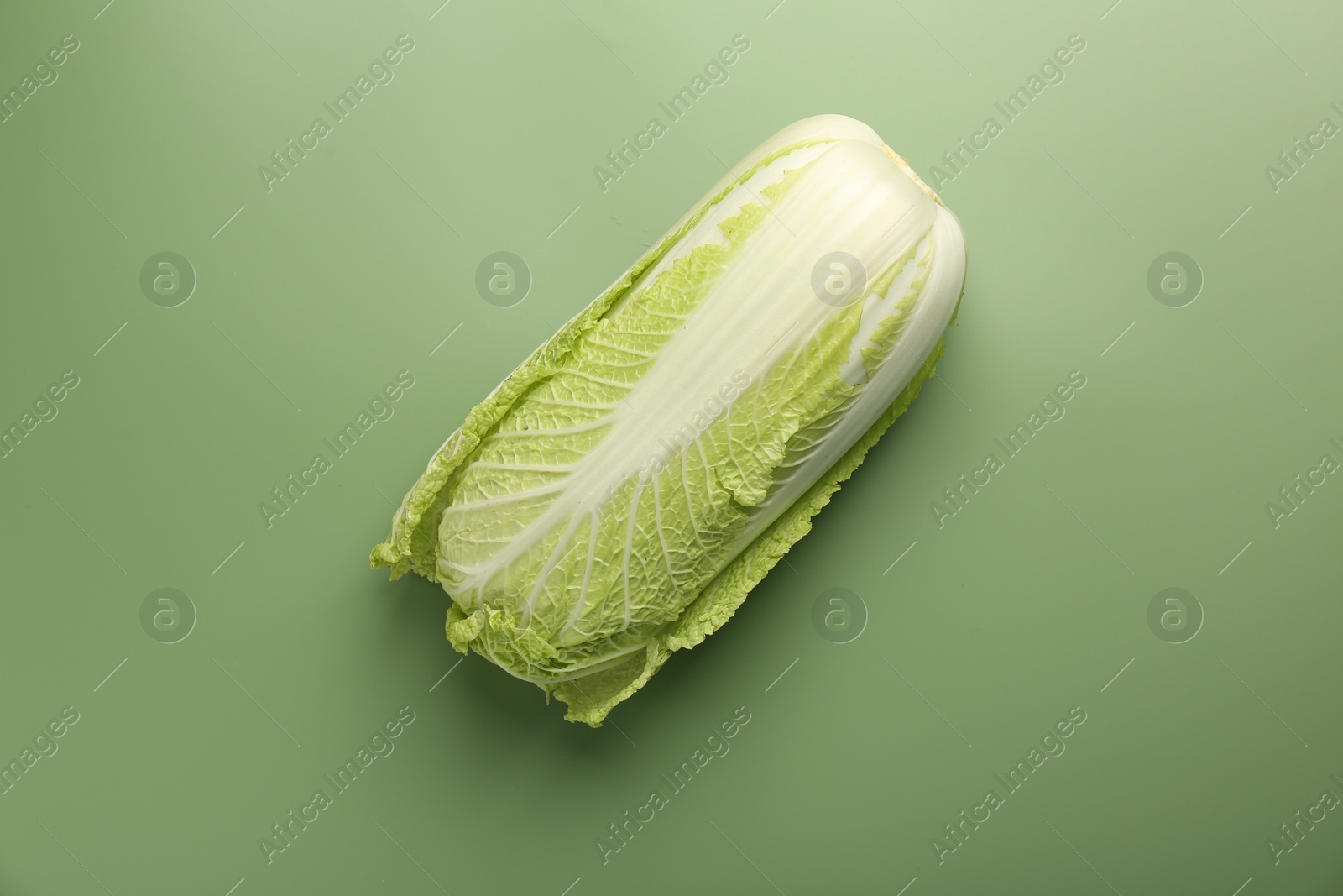 Photo of Fresh ripe Chinese cabbage on pale green background, top view