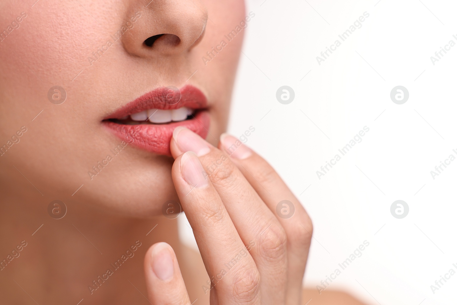 Photo of Woman with beautiful lips on white background, closeup. Space for text