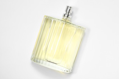 Luxury men`s perfume in bottle on white background, top view