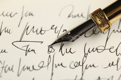 Photo of One fountain pen on handwritten letter, closeup
