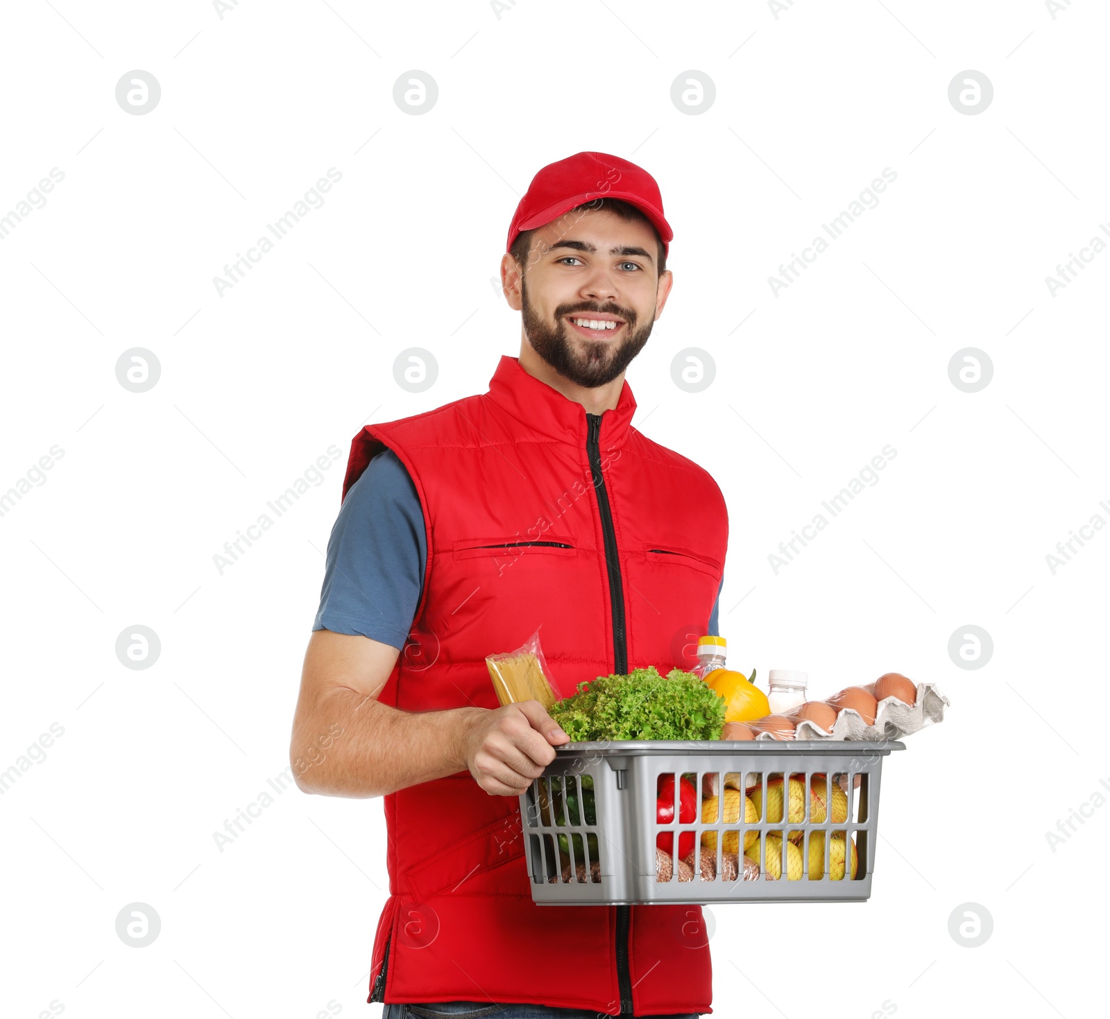 Photo of Man holding basket with fresh products on white background. Food delivery service