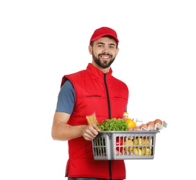 Photo of Man holding basket with fresh products on white background. Food delivery service