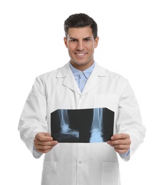 Orthopedist holding X-ray picture on white background