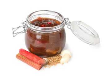 Tasty rhubarb sauce and ingredients isolated on white