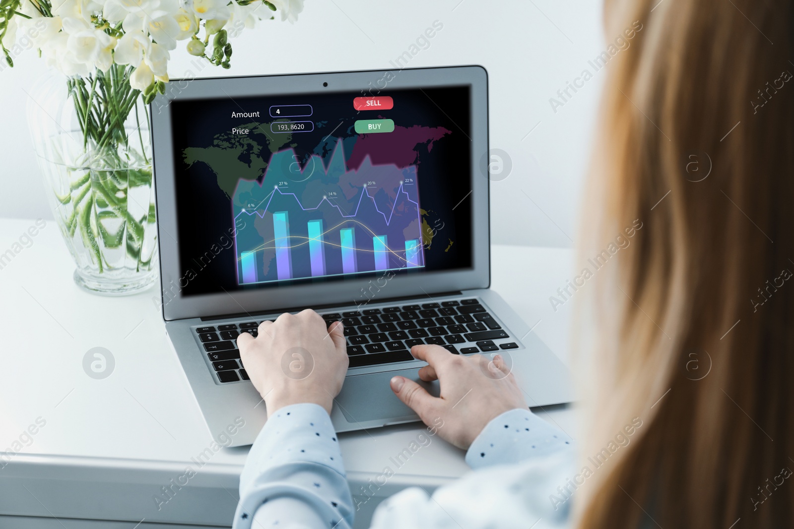 Image of  Broker working with laptop at table, closeup. Forex trading