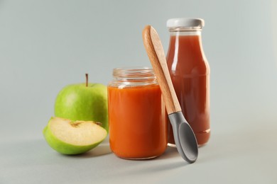 Photo of Healthy baby food, apple and juice on white background