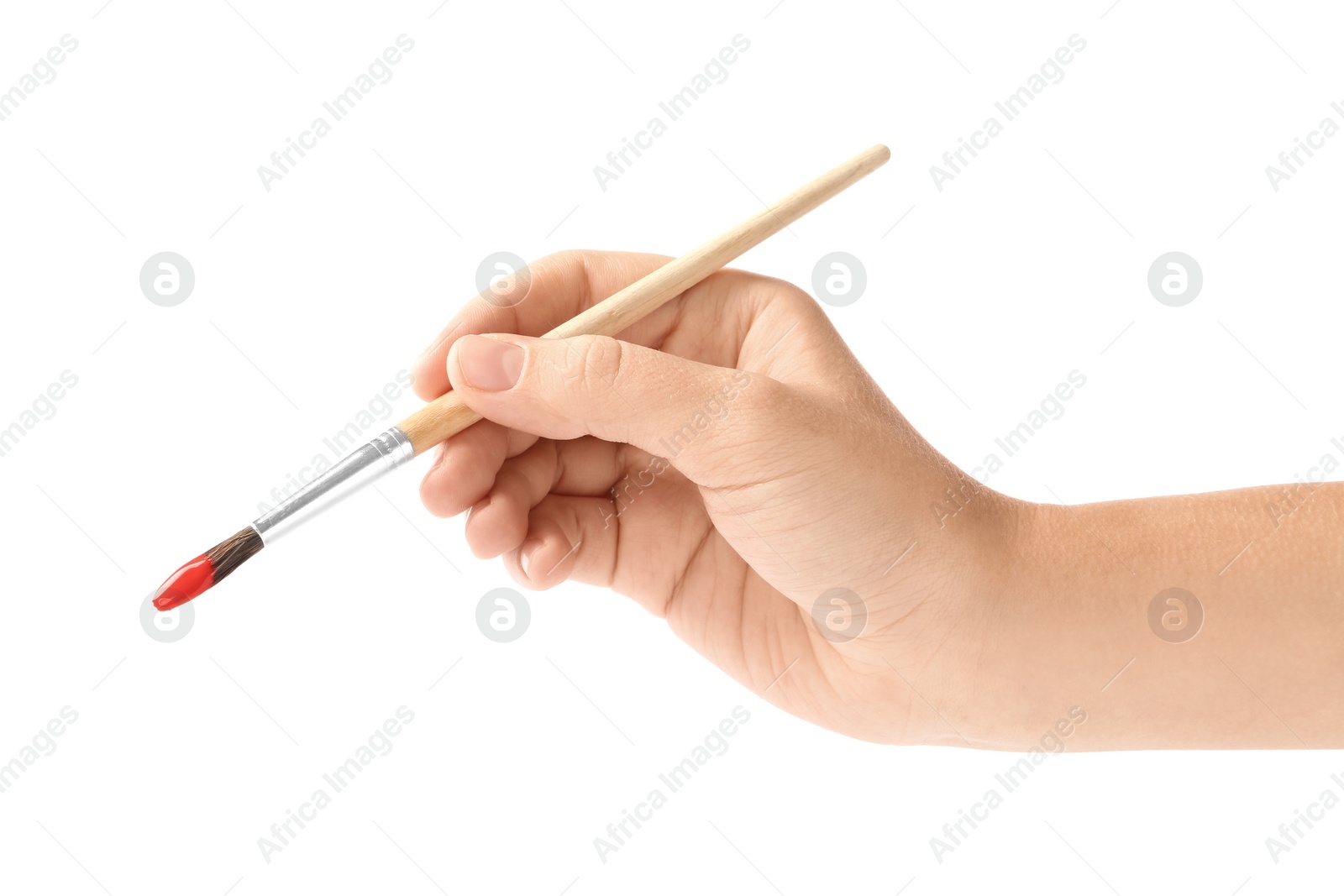 Photo of Young woman holding brush with color paint on white background, closeup