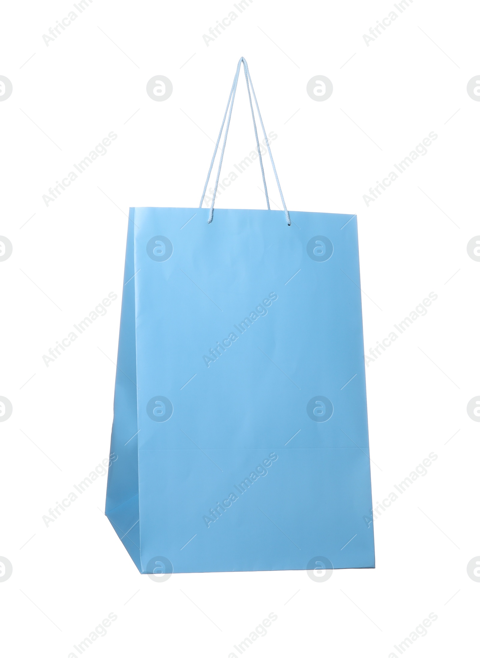 Photo of One light blue shopping bag isolated on white