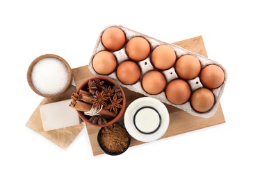 Eggs, yeast cake and different ingredients on white background, top view. Making pie