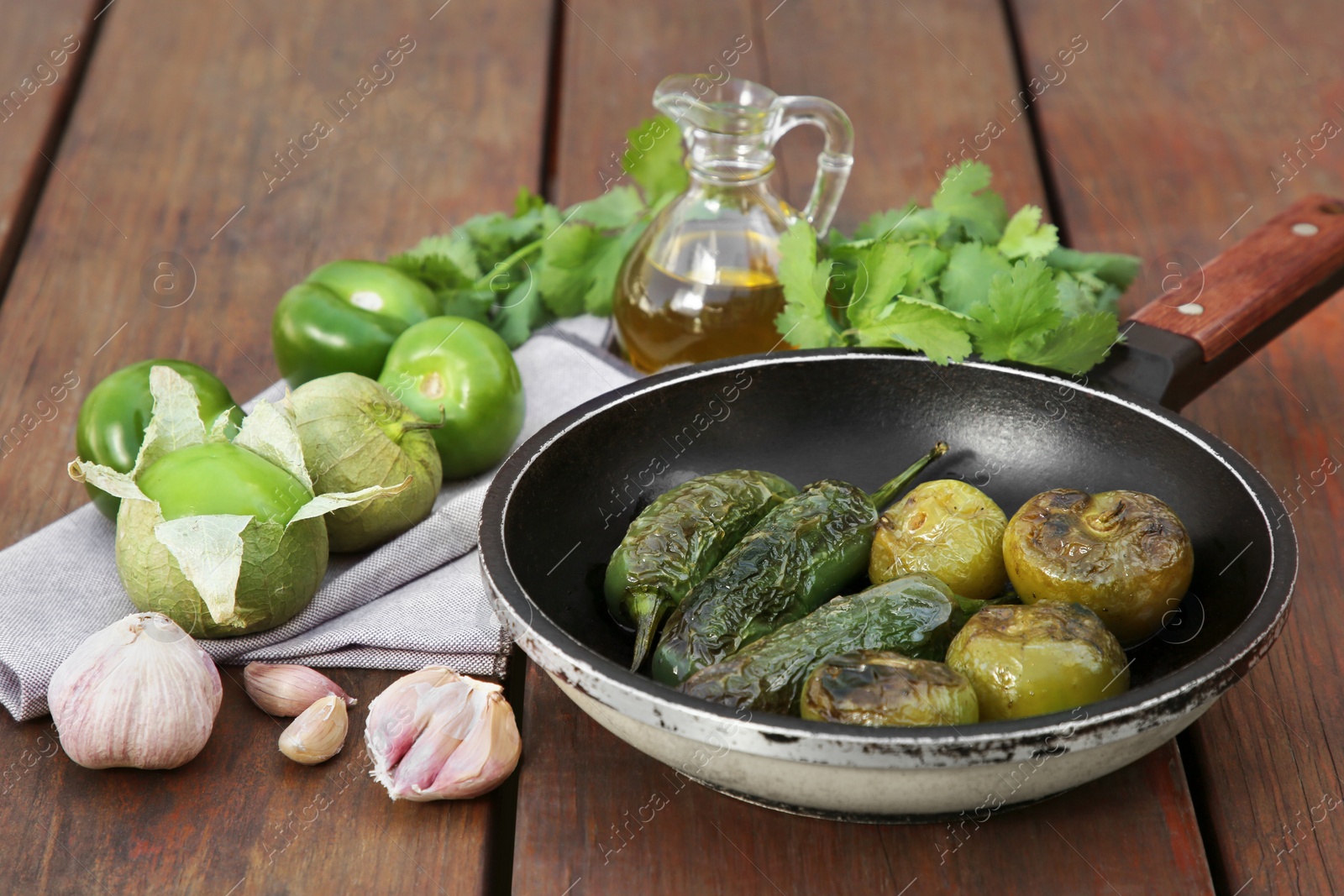 Photo of Different ingredients for cooking tasty salsa sauce on wooden table