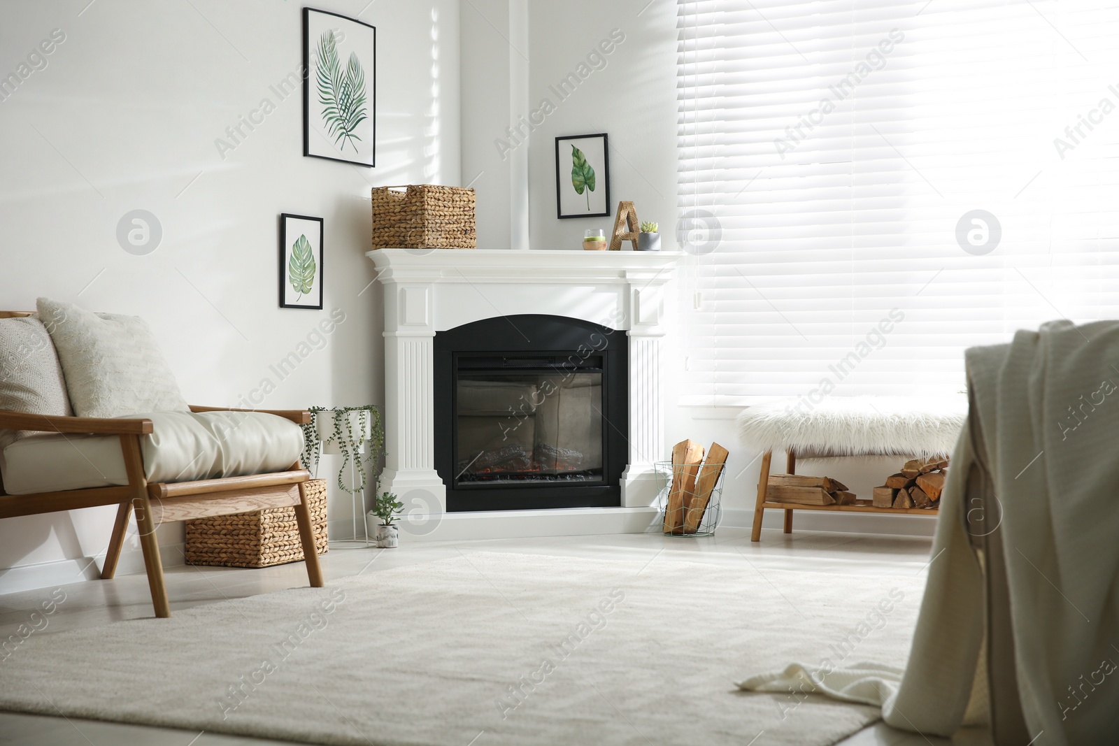 Photo of Bright living room interior with fireplace and armchair