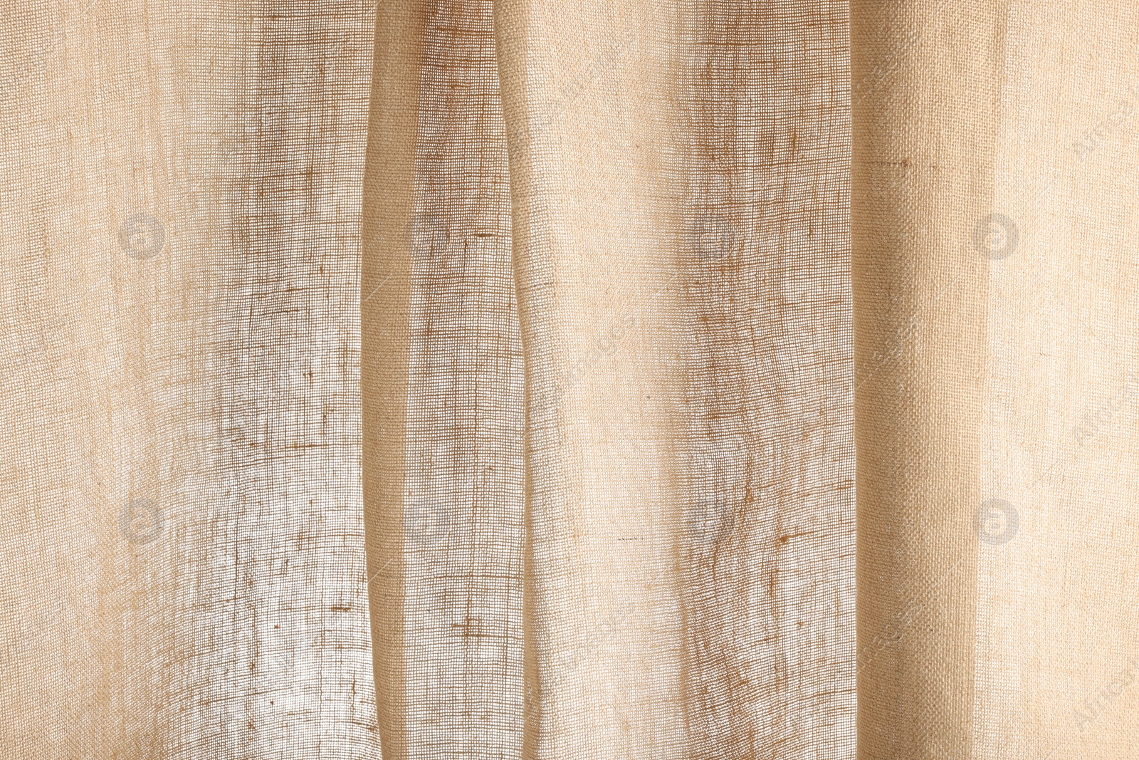 Photo of Texture of natural burlap fabric as background, closeup