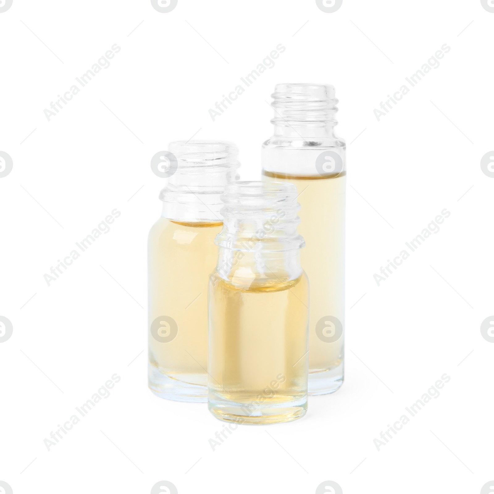 Photo of Glass bottles of essential oils on white background