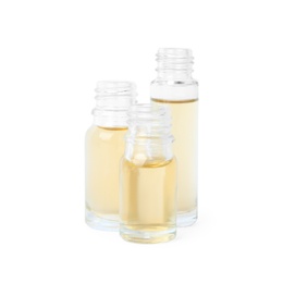 Glass bottles of essential oils on white background