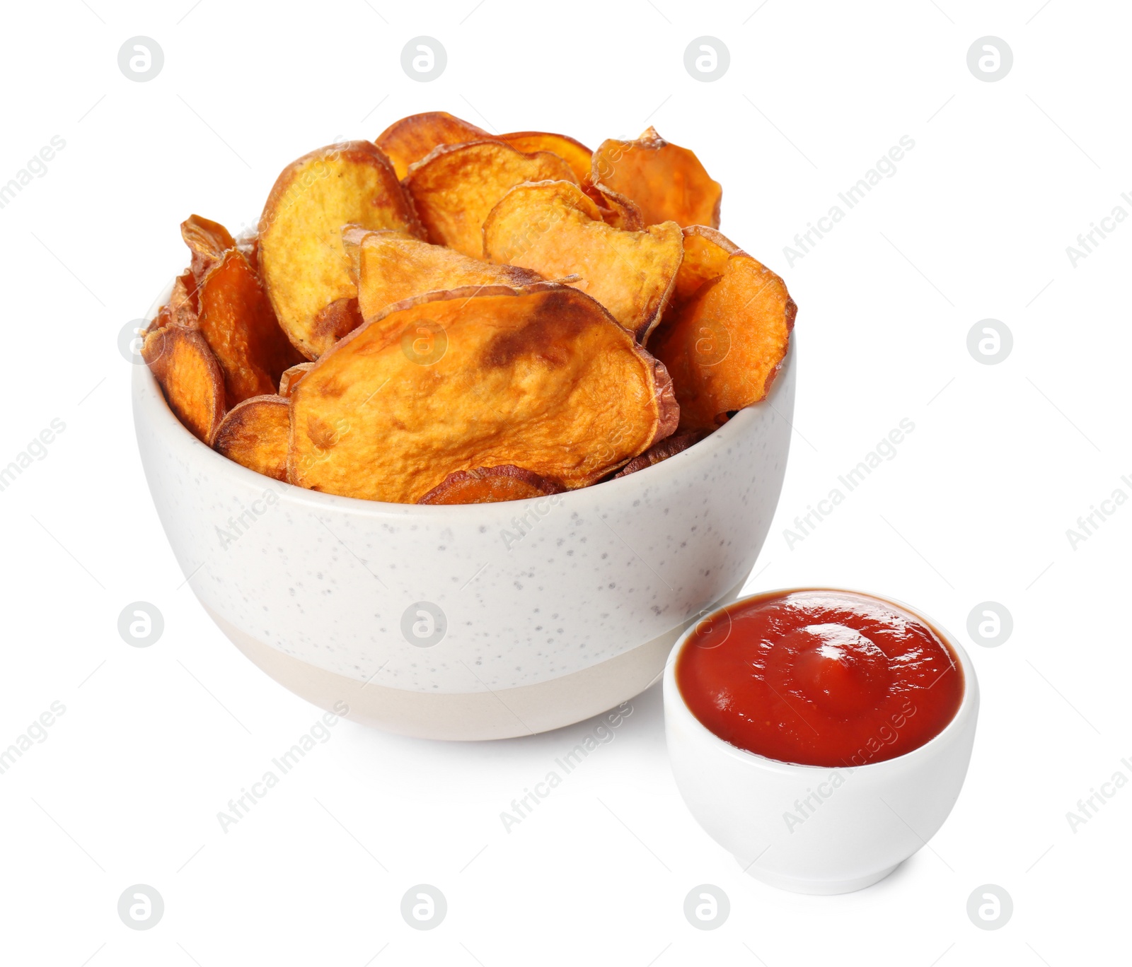 Photo of Bowl of sweet potato chips with sauce isolated on white