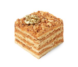 Photo of Piece of layered honey cake with walnuts on white background