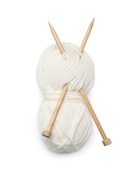 Photo of Soft woolen yarn with knitting needles on white background, top view