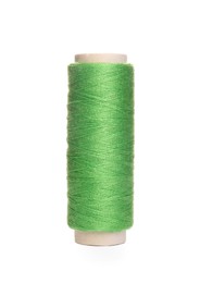 Photo of Spool of green sewing thread isolated on white