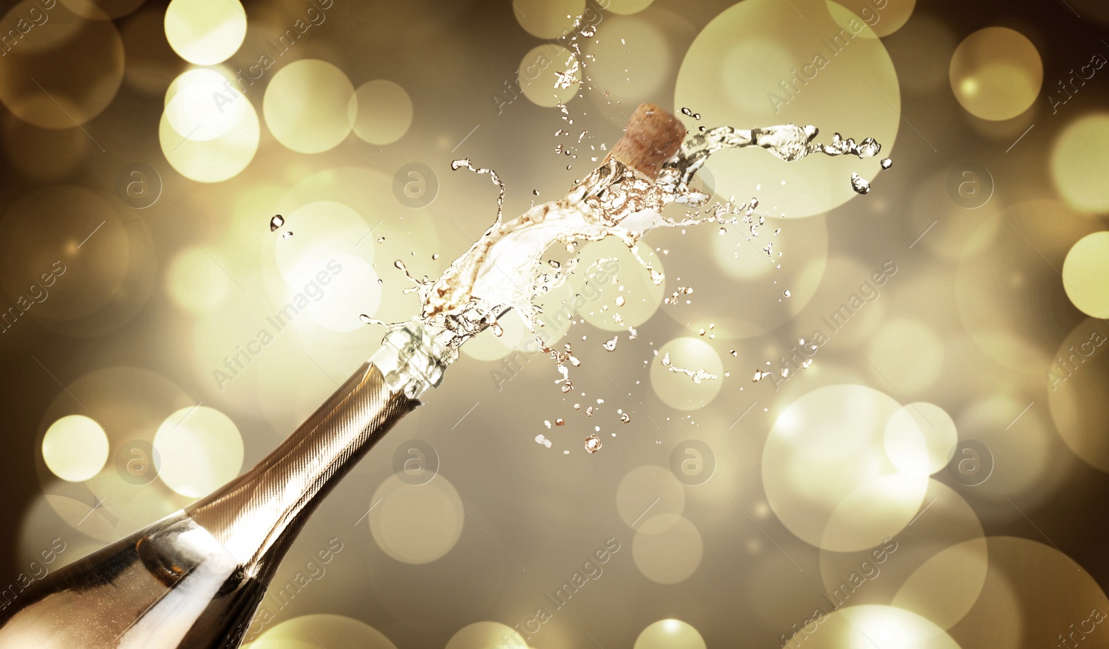 Image of Sparkling wine splashing out of bottle on color background, bokeh effect