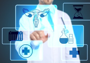 Menopause concept. Doctor touching uterus icon on digital screen against blue background, closeup