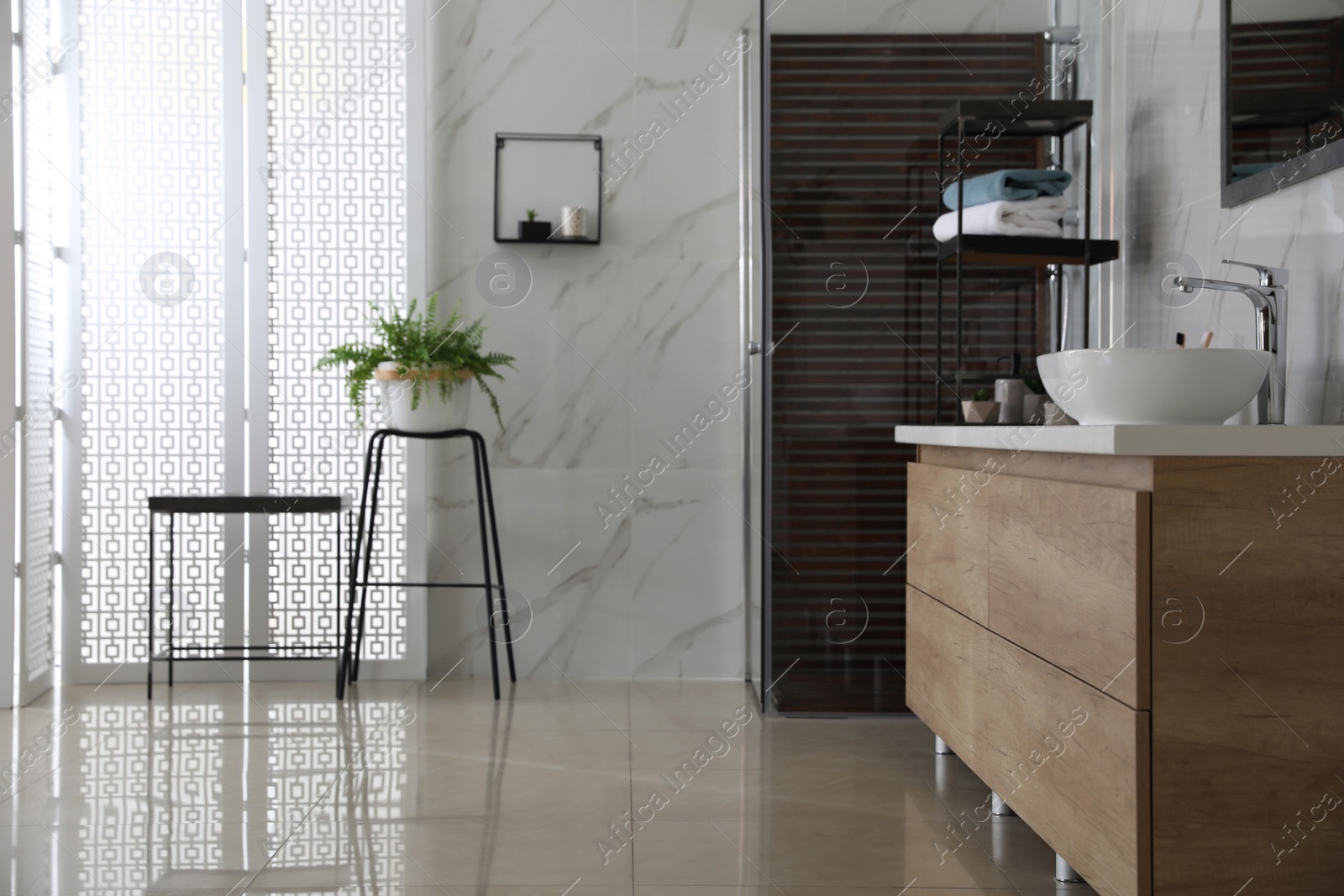 Photo of Bathroom interior with shower stall, houseplant and counter. Idea for design