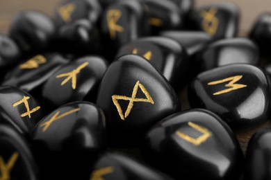 Black rune stones as background, closeup view