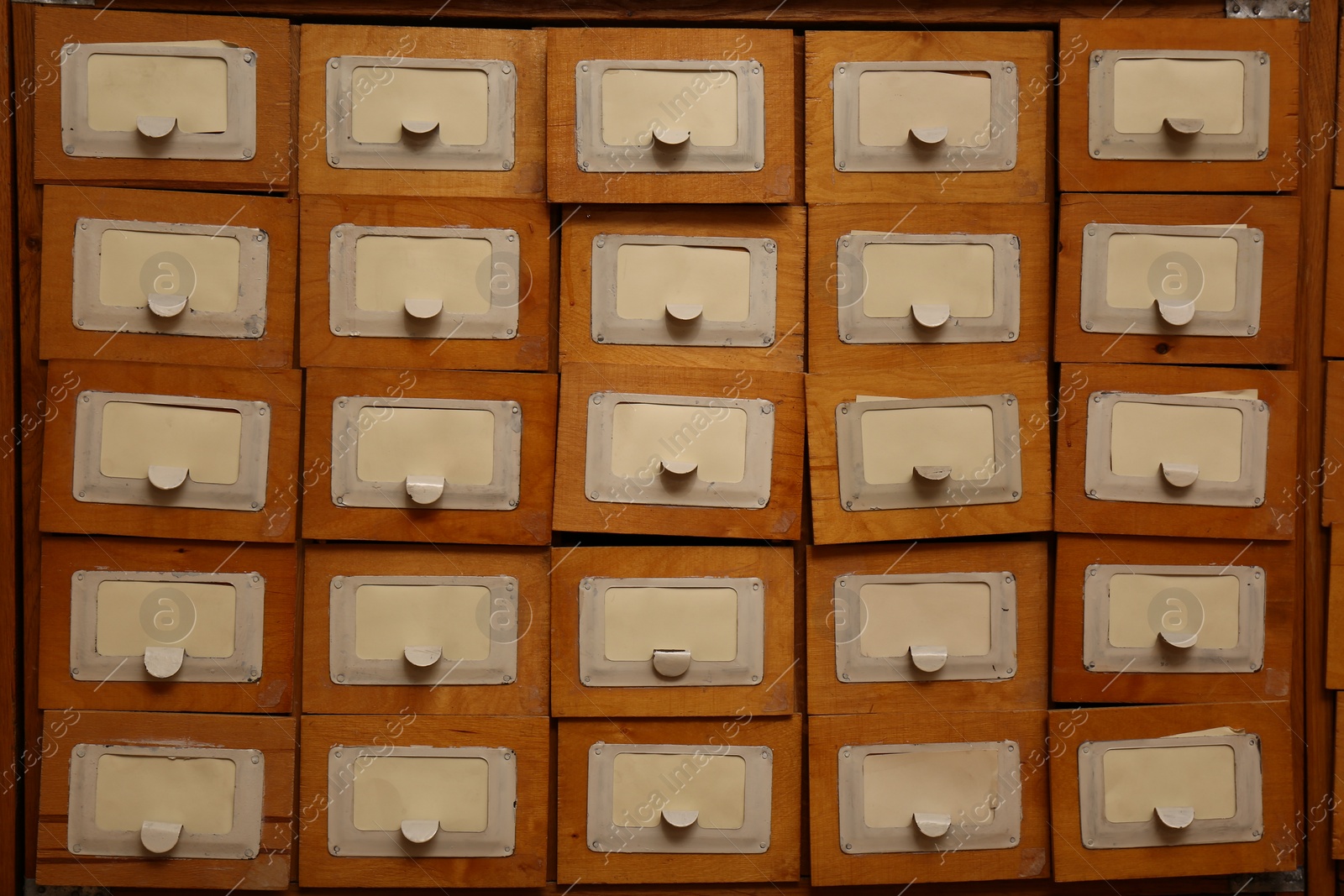 Photo of Library card catalog drawers as background, closeup