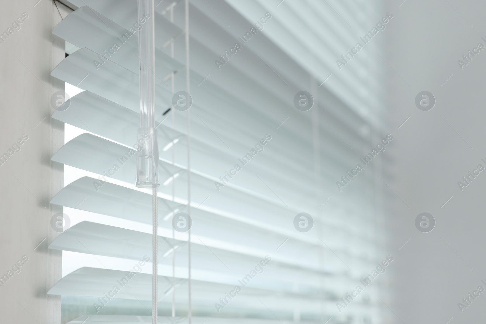 Photo of Closeup view of stylish horizontal window blinds