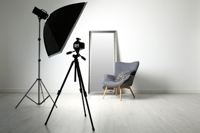 Photo of Interior of modern photo studio with professional equipment