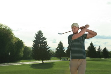 Photo of Man playing golf on green course, space for text