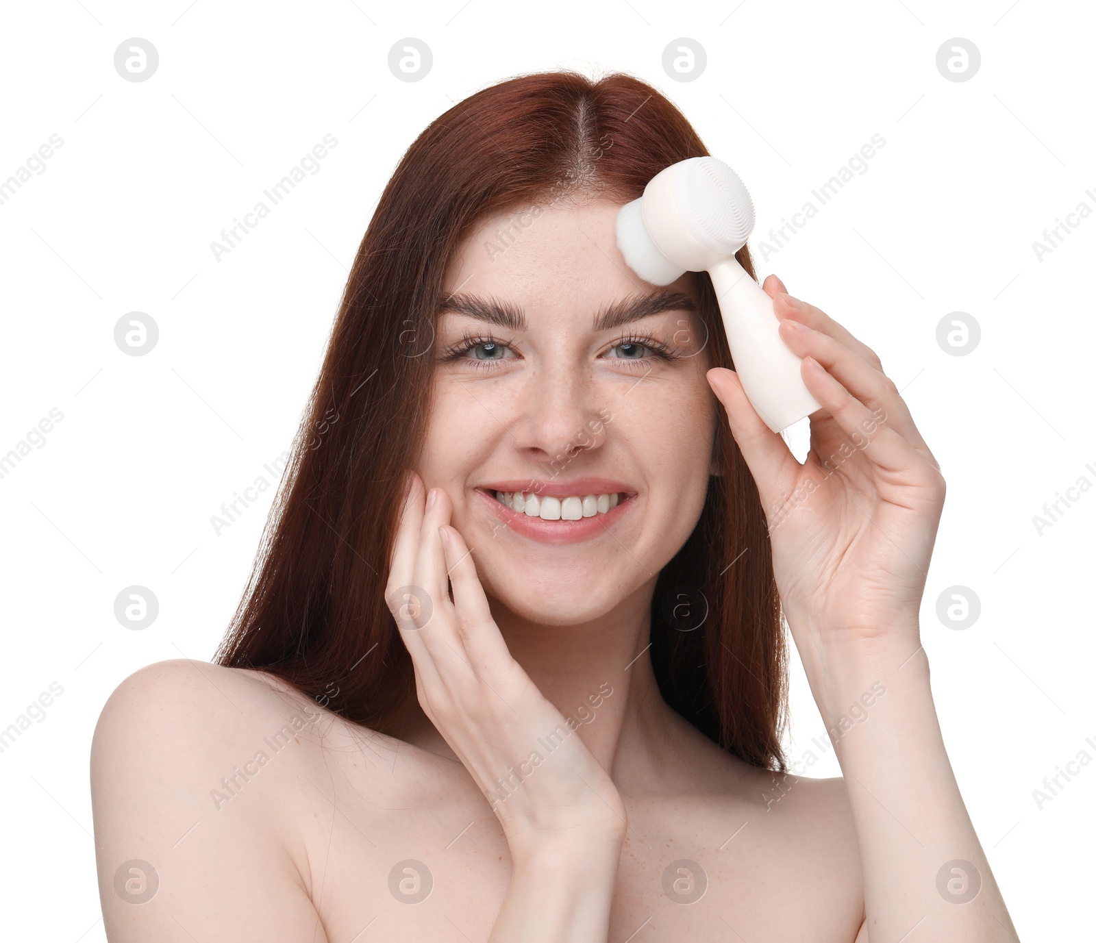 Photo of Washing face. Young woman with cleansing brush on white background