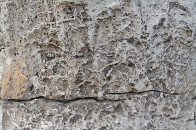 Photo of Closeup view of grey stone texture as background